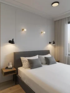 bedroom showcasing layered wall-mounted lighting design