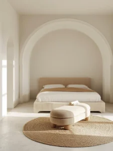 minimalist bedroom featuring a large arched