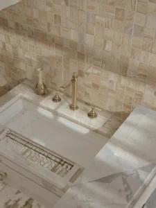 A kitchen backsplash and partial floor in a two-tone basket-weave mosaic