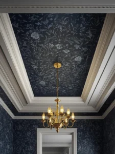 A living room tray ceiling with the recessed interior paneled in deep midnight blue botanical wallpaper