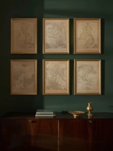 A living room wall in deep forest green paint