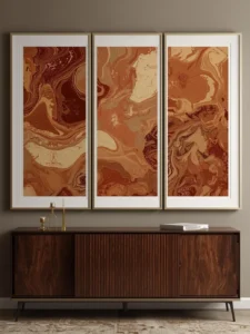 A living room wall with a triptych of three large hand