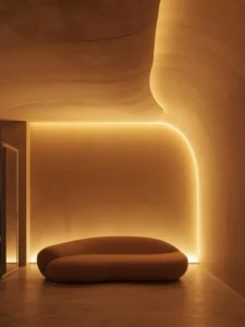 A living room with a smooth flowing curved plaster ceiling