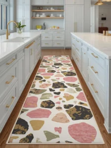 A long kitchen runner rug printed in an oversized terrazzo pattern