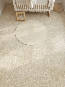 A nursery floor in warm terrazzo-look porcelain tile