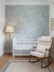A nursery with a single wall of hand-illustrated chinoiserie wallpaper in soft blue and white