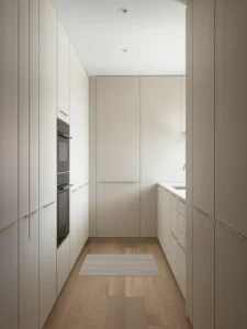 A sleek tiny kitchen where every appliance is hidden