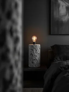 A thick raw concrete cylinder table lamp