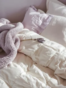 An extreme close-up of a luxuriously layered bed