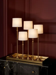 Five slim candlestick table lamps in graduated heights