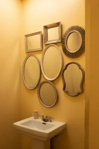 bathroom wall with clustered vintage mirror collection