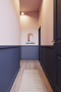 hallway with two-tone painted walls divided by a simple white chair rail