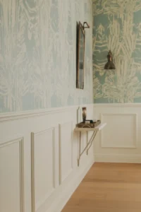 hallway with white painted wainscoting on the lower third of the walls
