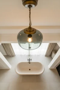 large smoked glass and aged brass pendant light