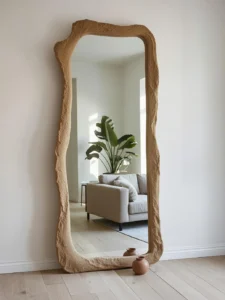 living room wall with a floor-leaning oversized mirror
