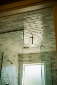 master bathroom shower with floor-to-ceiling