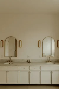 ong continuous marble countertop spanning full wall width with two undermount sinks