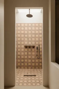 open walk-in shower with floor-to-ceiling encaustic cement tile