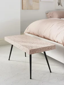 rectangular bedroom bench with a thick blush-pink terrazzo