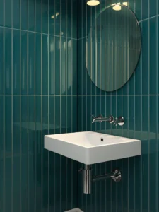 tiled in vertically-oriented subway tiles