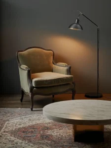 worn antique Louis-style armchair reupholstered