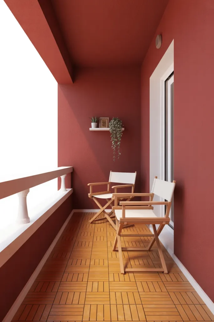 small balcony with a deep terracotta painted exterior wall