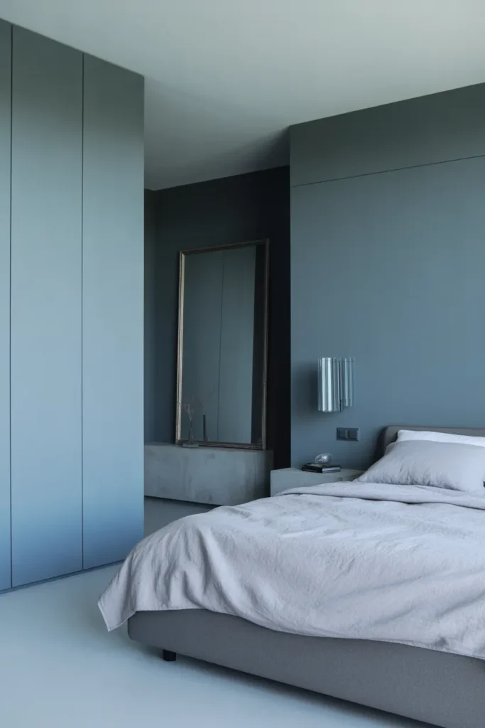 steel blue-grey walls in high-ceiling contemporary bedroom