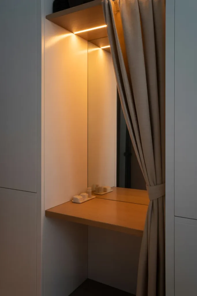 A Built-In Vanity Nook Inside a Closet Alcove That Hides Away Completely