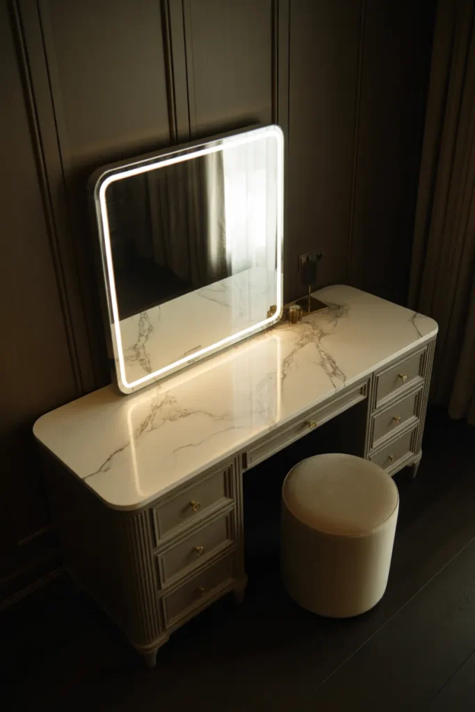 A Luxury Vanity Desk With Stone Surfaces and Backlit Mirror for a High-End Look