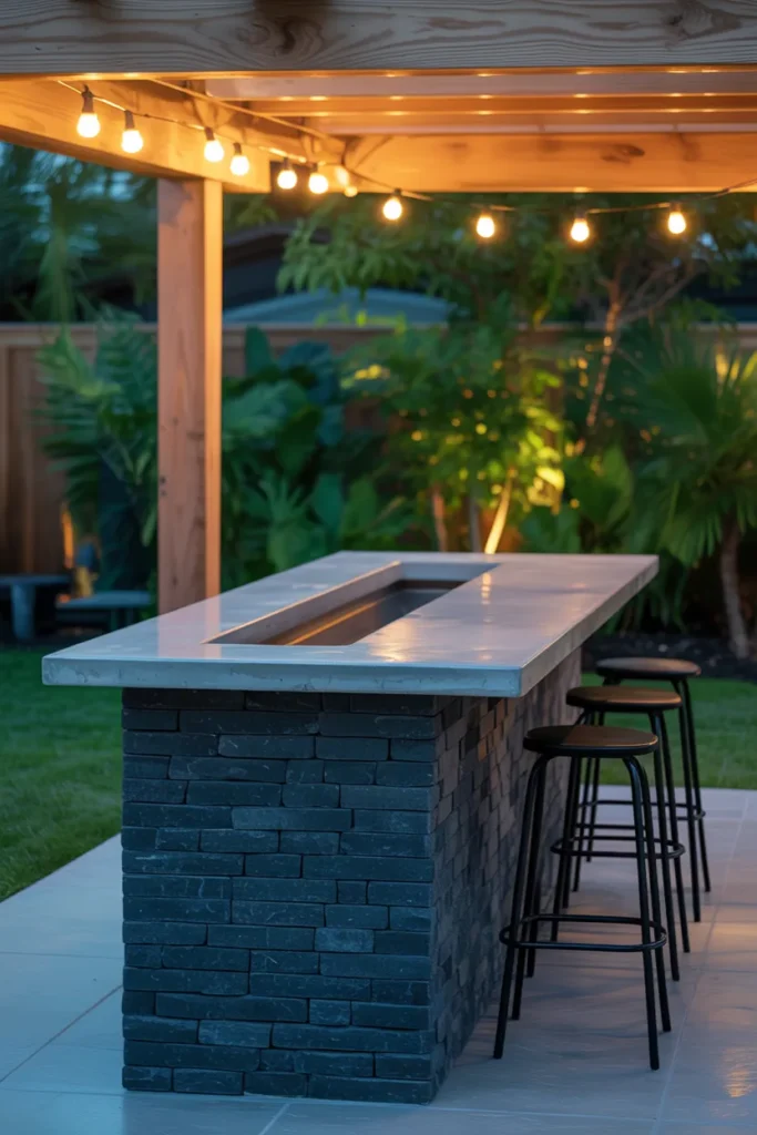The Built-In Stone Bar That Anchors a Patio and Handles Heavy Outdoor Use
