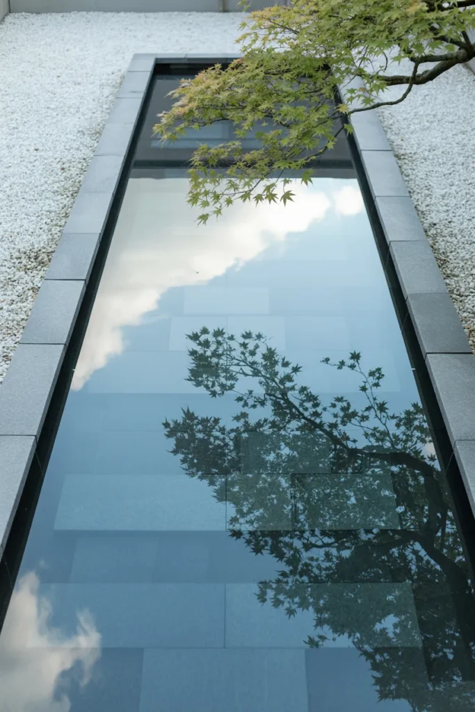 Zen Water Garden With Still Reflecting Pool and Stone Border